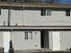 Exterior of home with new siding and neutral color scheme at 4505 Everett St, Wheat Ridge, CO 80033
