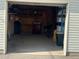 Organized garage space with storage shelves and ample room for parking at 4505 Everett St, Wheat Ridge, CO 80033