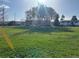 Expansive green space near the property with a bright sky and visible residences in the background at 4505 Everett St, Wheat Ridge, CO 80033