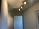 Hallway featuring track lighting and doorway at 4505 Everett St, Wheat Ridge, CO 80033