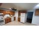 Bright kitchen with tile floors, stainless appliances, and oak cabinets at 4505 Everett St, Wheat Ridge, CO 80033