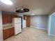 Spacious kitchen features tile flooring, wood cabinetry, and modern appliances at 4505 Everett St, Wheat Ridge, CO 80033