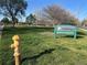Boyd's Crossing Park featuring green space, mature trees, a fire hydrant and playground equipment at 4505 Everett St, Wheat Ridge, CO 80033