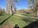 Walking path near residences with natural scenery, mature trees and spring foliage visible at 4505 Everett St, Wheat Ridge, CO 80033