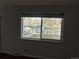 A view of the outside neighborhood through the living room window at 4505 Everett St, Wheat Ridge, CO 80033