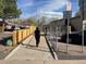 Walking path near residences with signage and a clear view of a peaceful neighborhood setting at 4505 Everett St, Wheat Ridge, CO 80033