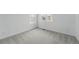 This carpeted bedroom has bright white walls and multiple windows for natural light at 8840 Whiteclover St, Littleton, CO 80125