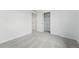 This bedroom features neutral carpet, bright white walls, and a closet at 8840 Whiteclover St, Littleton, CO 80125