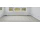 Bright bedroom with neutral carpet, recessed lights and three windows at 8840 Whiteclover St, Littleton, CO 80125