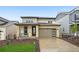 Beautiful two-story home with a stone-accented facade and a well-maintained front yard at 8840 Whiteclover St, Littleton, CO 80125