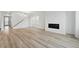 Spacious living room with hardwood floors, fireplace, and ample natural light at 8840 Whiteclover St, Littleton, CO 80125