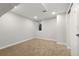 Finished basement with carpeting, neutral paint, and trim at 3287 S Humboldt St, Englewood, CO 80113