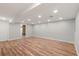 Bright basement space with clean flooring, neutral paint, and recessed lighting at 3287 S Humboldt St, Englewood, CO 80113