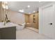 Luxurious bathroom featuring a soaking tub, walk-in shower with niche, and double sink vanity at 3287 S Humboldt St, Englewood, CO 80113