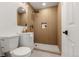 Modern bathroom with a walk-in shower, rainfall shower head, and a sleek vanity with gold faucet at 3287 S Humboldt St, Englewood, CO 80113