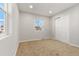 Bedroom with neutral carpet, a window offering natural light, and a closet with sliding doors at 3287 S Humboldt St, Englewood, CO 80113