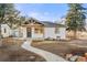Charming home featuring a welcoming walkway leading to a quaint covered front porch at 3287 S Humboldt St, Englewood, CO 80113