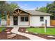 Home exterior showcasing a modern design, inviting entrance, and beautifully landscaped front yard at 3287 S Humboldt St, Englewood, CO 80113