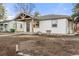 Quaint home with a covered porch, neat landscaping and a freshly painted exterior at 3287 S Humboldt St, Englewood, CO 80113