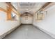 Inside detached garage with painted walls, concrete floor, ceiling fan and updated windows for light at 3287 S Humboldt St, Englewood, CO 80113