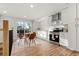 Sunlit kitchen with stainless steel appliances, white cabinetry, dining area and a sliding glass door for outdoor access at 3287 S Humboldt St, Englewood, CO 80113