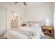 Bright bedroom with ensuite bathroom access, neutral decor, and ample natural light at 1616 S Broadway # 217, Denver, CO 80210