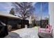 Cozy backyard featuring modern fence, outdoor seating, and stylish patio rug at 3003 S Sherman St, Englewood, CO 80113