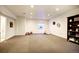 Spacious finished basement with recessed lighting, perfect for a playroom or entertainment area at 3003 S Sherman St, Englewood, CO 80113