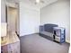 Neutral Bedroom with gray crib and changing table, showcasing modern design and closet with sliding doors at 3003 S Sherman St, Englewood, CO 80113