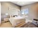 Comfortable bedroom with hardwood floors, a large window, and relaxing neutral color palette at 3003 S Sherman St, Englewood, CO 80113