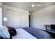 Cozy bedroom with large windows, featuring modern furnishings, comfortable bed, and ceiling fan at 3003 S Sherman St, Englewood, CO 80113
