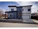 Modern two-story home featuring sleek exterior design, stylish finishes, and a two-car garage at 3003 S Sherman St, Englewood, CO 80113