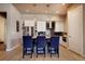 Open kitchen with island seating, stainless steel appliances and sleek cabinetry at 3003 S Sherman St, Englewood, CO 80113