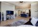 Open concept living room and kitchen featuring a breakfast bar and stainless steel appliances at 3003 S Sherman St, Englewood, CO 80113