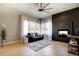 Bright living room with hardwood floors, fireplace and large windows with neighborhood views at 3003 S Sherman St, Englewood, CO 80113