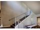 Modern staircase with sleek railings and carpeted steps, offering a stylish transition between floors at 3003 S Sherman St, Englewood, CO 80113