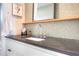 This remodeled bathroom features sleek counter tops and modern faucet fixtures at 2182 S Ogden St, Denver, CO 80210