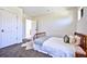 This bedroom features neutral walls, carpet and a standard closet door at 2182 S Ogden St, Denver, CO 80210