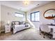 This bedroom includes a long window allowing natural light and desk area at 2182 S Ogden St, Denver, CO 80210