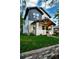 Beautiful two-story home with manicured lawn, brick and siding, covered front porch, and professional landscaping at 2182 S Ogden St, Denver, CO 80210