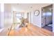 Upstairs hallway with wood floors, natural light, and access to bedrooms and bathrooms at 2182 S Ogden St, Denver, CO 80210