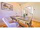 Bright home office with hardwood floors, area rug, statement desk, and neutral paint color at 2182 S Ogden St, Denver, CO 80210