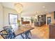Open layout shows living area, kitchen with island, dining area and lots of natural light at 2182 S Ogden St, Denver, CO 80210