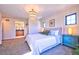 Main bedroom offers a chandelier, bright windows, and ensuite bathroom with double sink at 2182 S Ogden St, Denver, CO 80210