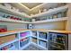 Well-organized pantry features open shelving, countertop space, and beverage fridge at 2182 S Ogden St, Denver, CO 80210