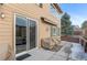 Covered patio with sliding glass door access, and space for outdoor furniture at 3953 Blue Pine Cir, Highlands Ranch, CO 80126