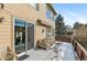 Covered patio with sliding glass door access, and space for outdoor furniture at 3953 Blue Pine Cir, Highlands Ranch, CO 80126