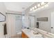 Bathroom with double vanity and a shower/tub combo at 3953 Blue Pine Cir, Highlands Ranch, CO 80126