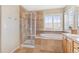 Large bathroom with soaking tub, walk-in shower, and double vanity at 3953 Blue Pine Cir, Highlands Ranch, CO 80126