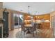 Kitchen dining area with hardwood floors and sliding doors at 3953 Blue Pine Cir, Highlands Ranch, CO 80126